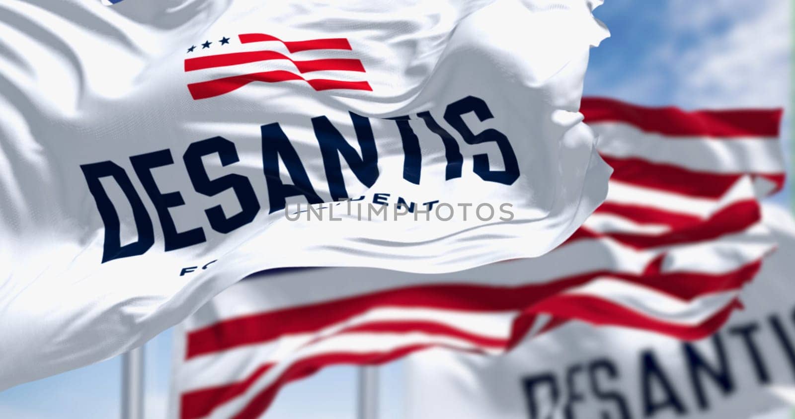 Tallahassee, US, Nov. 30 2023: Ron DeSantis 2024 Republican presidential primaries campaign flags waving with national US flag. Illustrative editorial 3d illustration render. Republican primaries