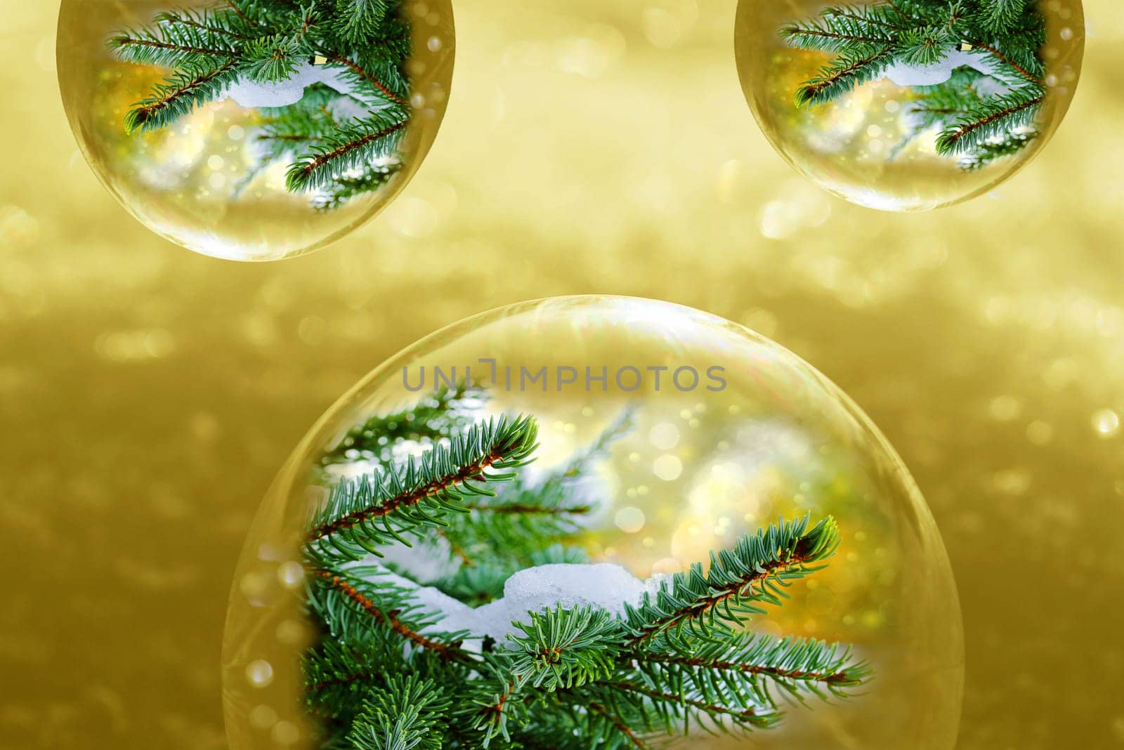 Christmas golden background with glittering snowflakes and fir branches in baubles