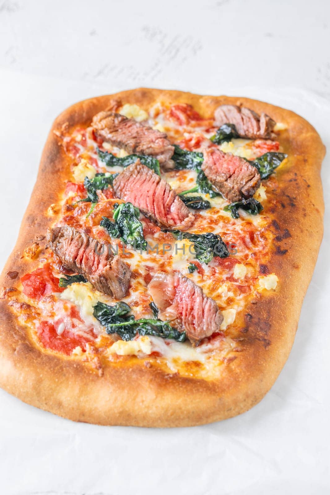 Beef steak focaccia with spinach and cheese