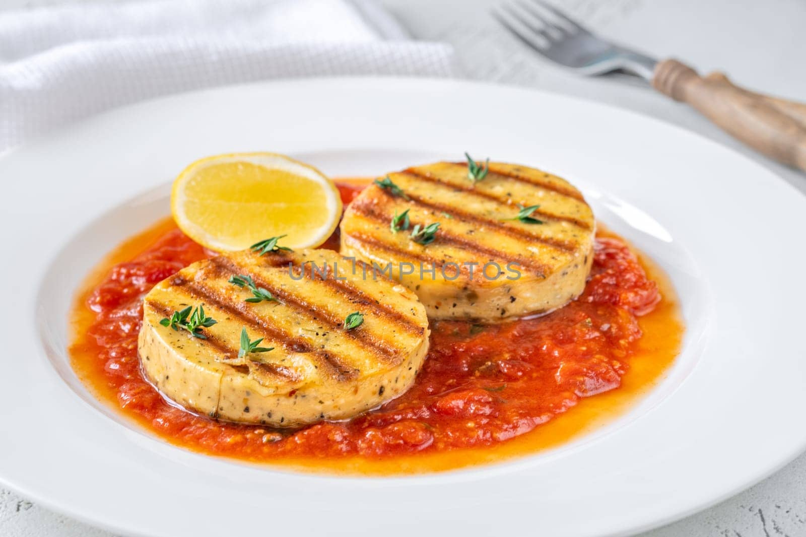 Portion of grilled cheese with tomato basil sauce