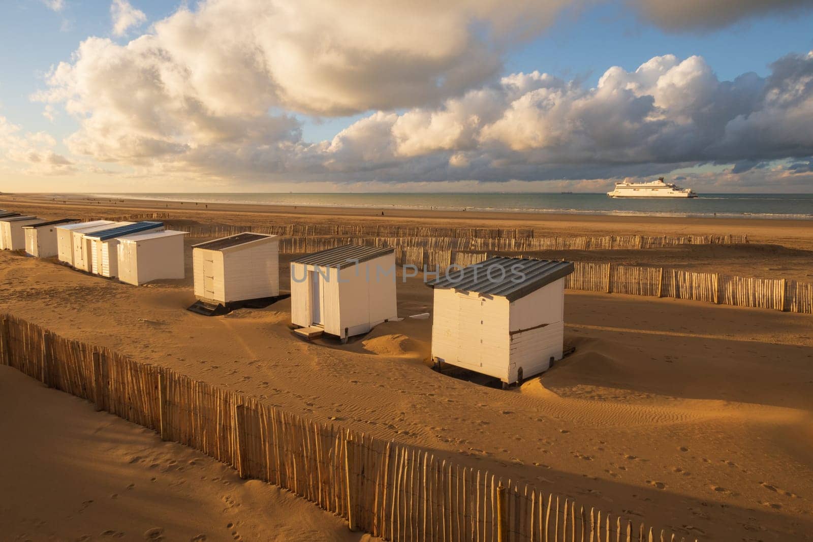 Beautiful landscape of the coast and harbor with cabins and the departure of a ferry in Calais, north of France