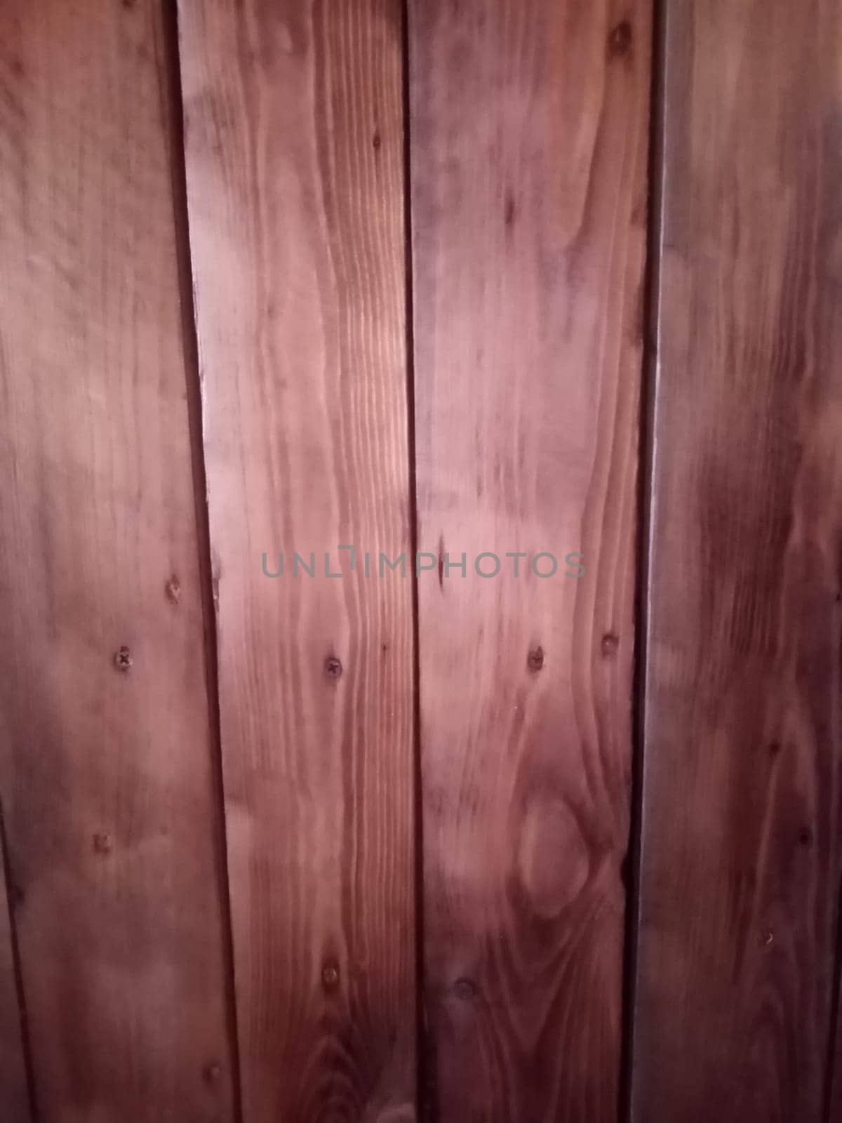 wood texture background in brown red color. High quality photo. Can used for texture backdrop, background for floor goods, wallpapers, long vertical planks.