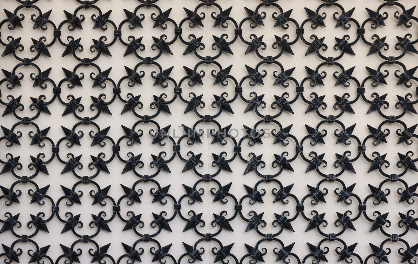 Detail of an ancient window with grating in wrought iron. Venice, Italy,