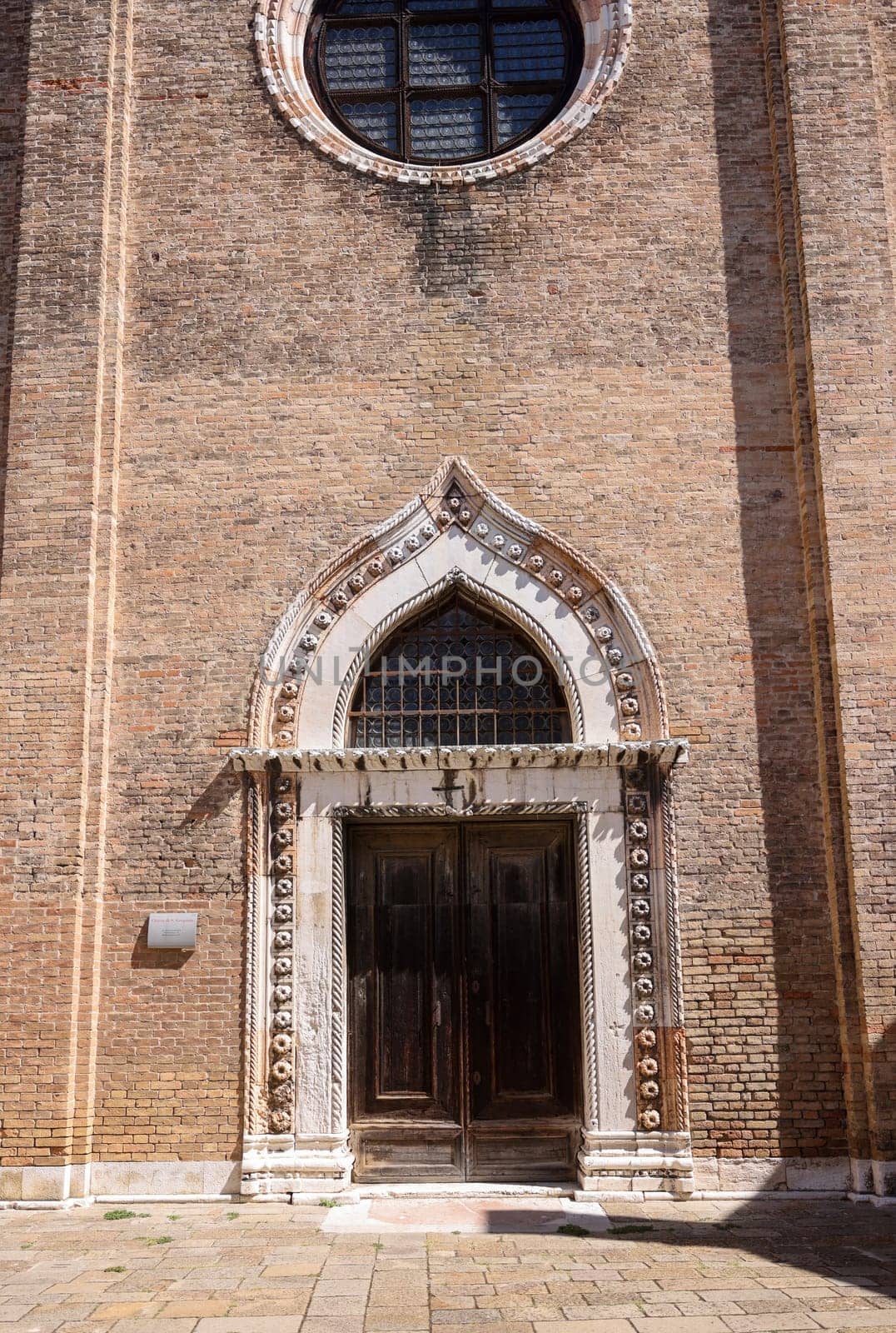 Ornate doorway and facade of the church of San Gregorio, Venice, Italy