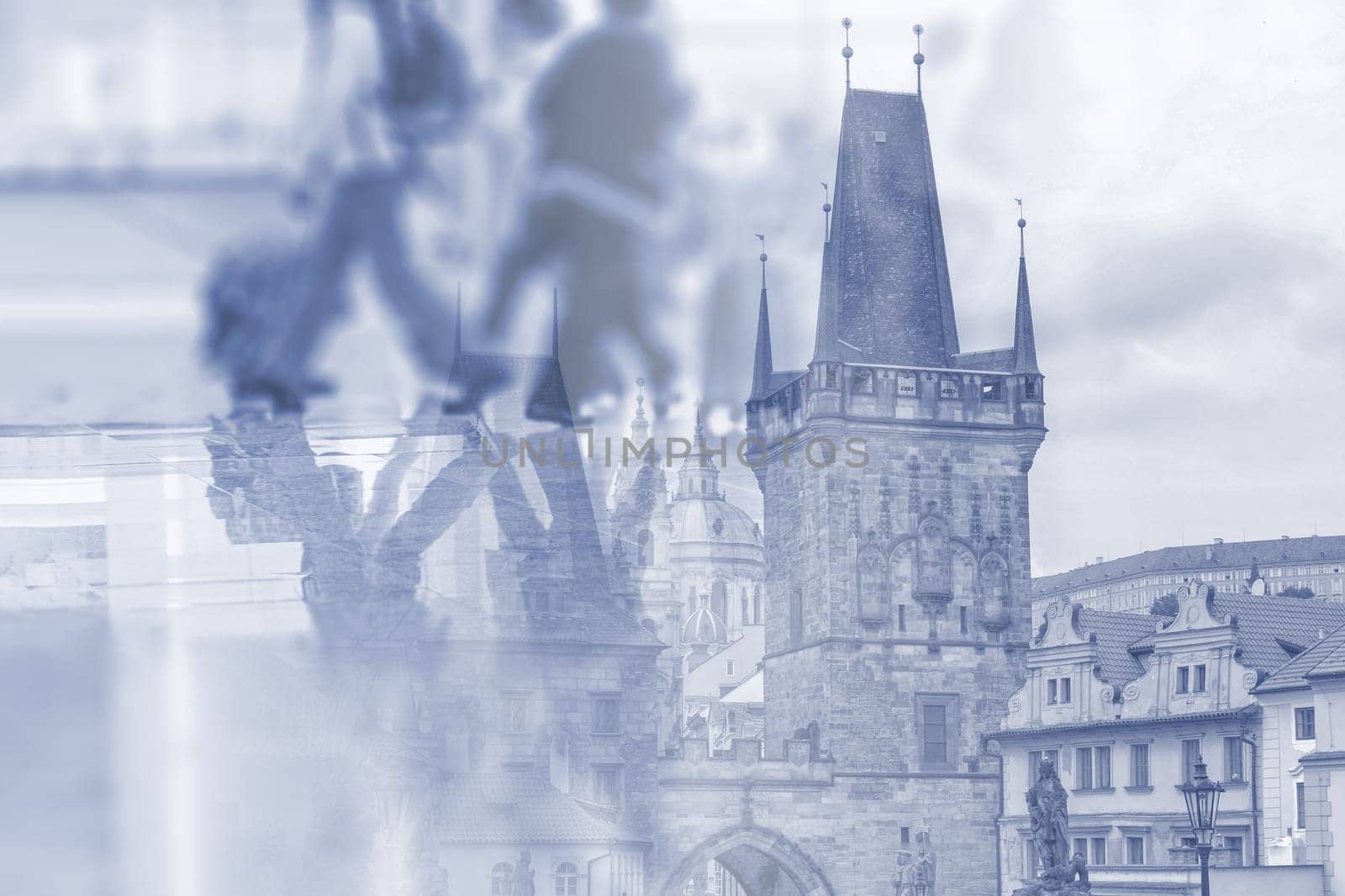 Abstract image of people walking in the airport with  Charles Bridge in Prague as double exposure background. It can be used as background of travel to Prague.
