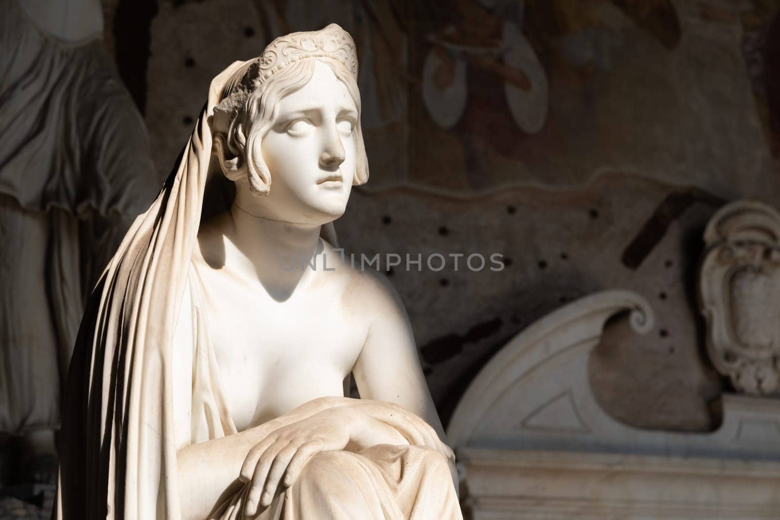 Pisa, Italy - June 2023: catholic cemetery, antique statue of sad woman, by Lorenzo Bartolini, 1841