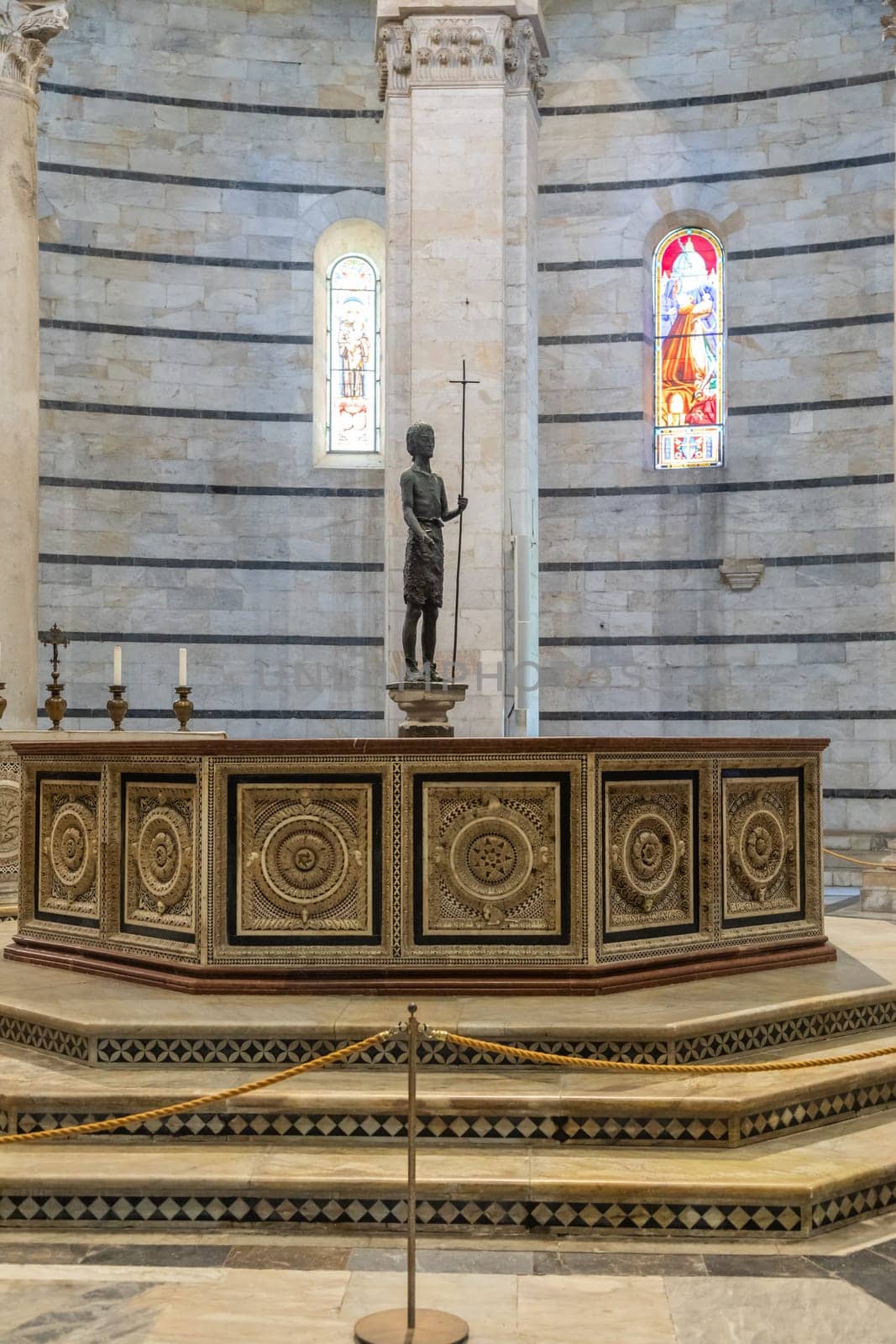 Pisa, Italy - 29 June 2023: Baptistery interior, basilica altar, catholic church. Italy travel destination.