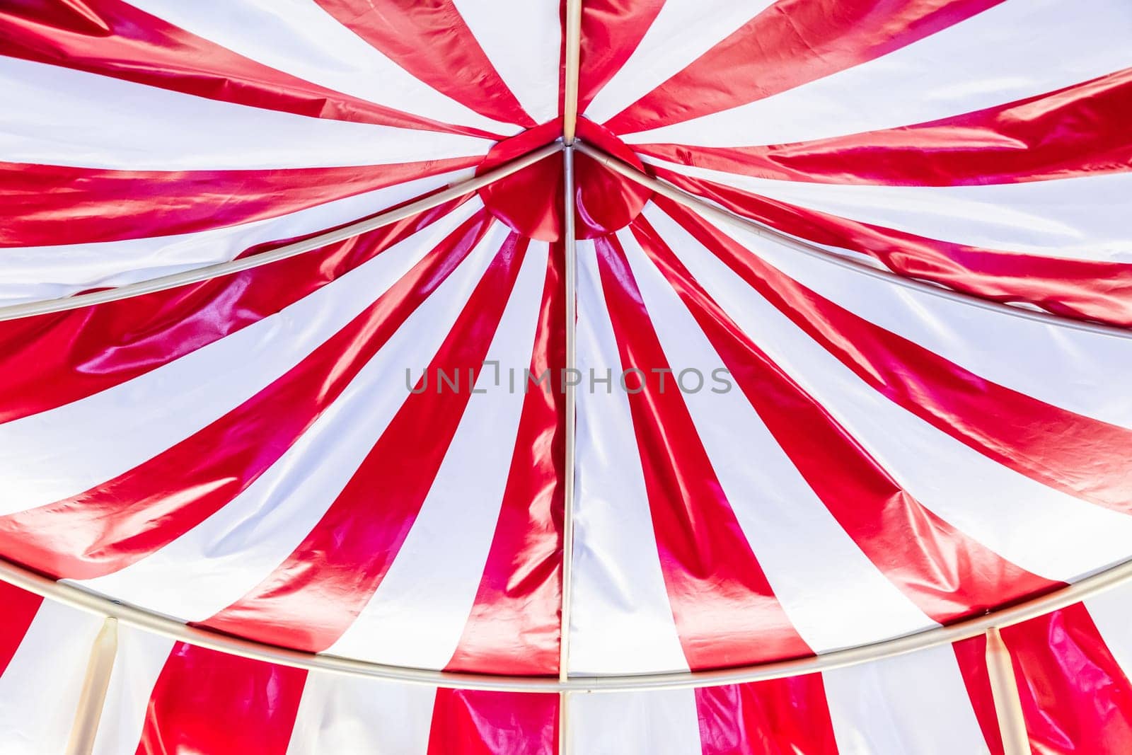 Circus tent background. Colorful design, striped white and red, retro entertainment.