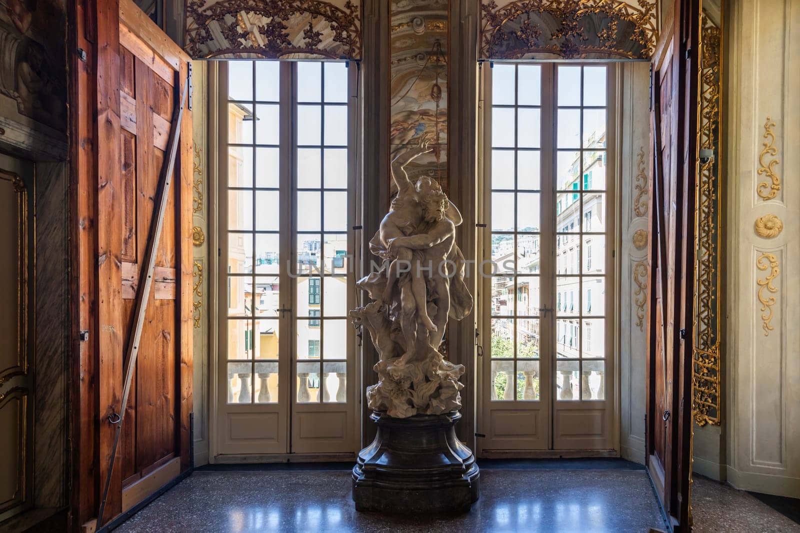 Genova, Italy - 6 August 2023: Royal Palace museum interior. Luxury marble, gallery with windows and mirrors.