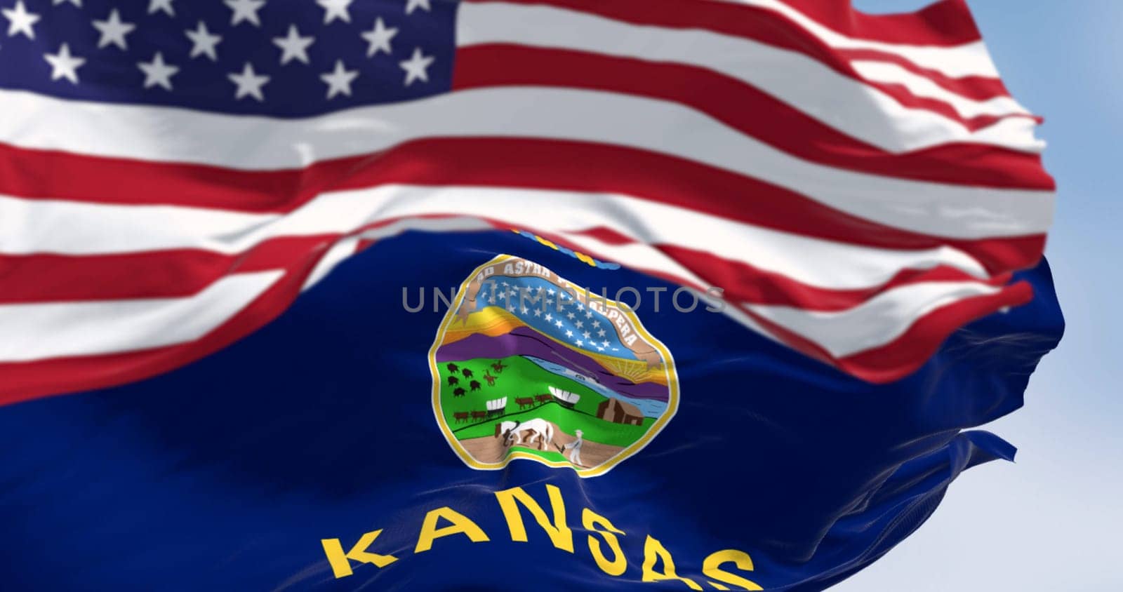 Kansas state flag and the American flag waving in the wind on a clear day. US state flag. Pride and patriotism concept. 3d illustration render. Rippled Fabric. Selective focus