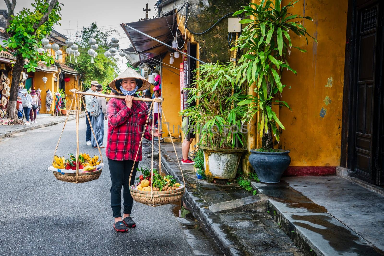 Hoi An, Vietnam, November 20, 2022: A street fruit vendor in the city of Hoi An in Vietnam