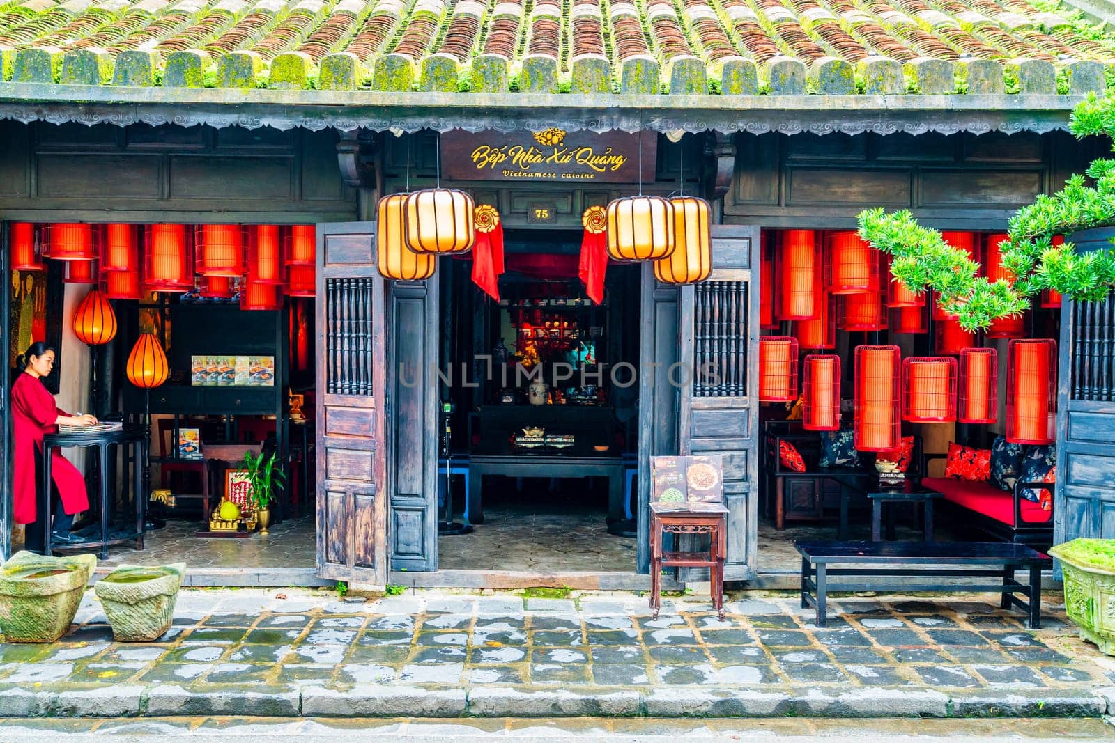 Hoi An, Vietnam, November 20, 2022: Entrance to a Vietnamese restaurant in the central part of historic town of Hoi An in Vietnam