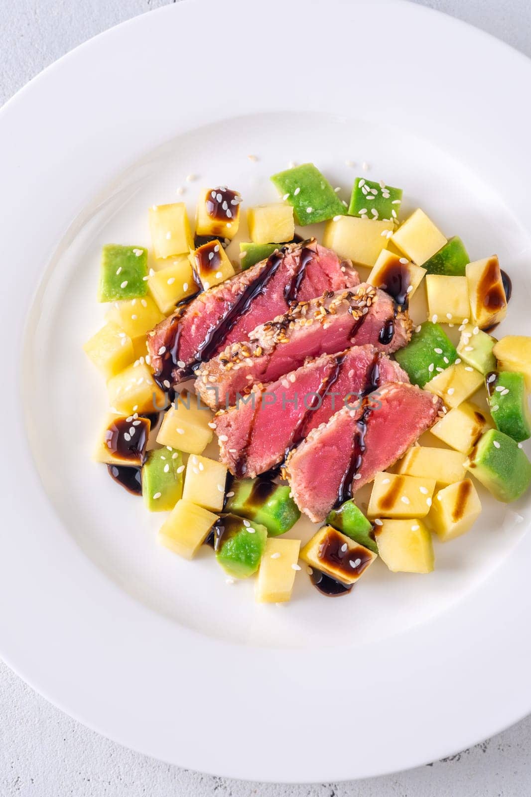 Portio of tuna with mango and avocado