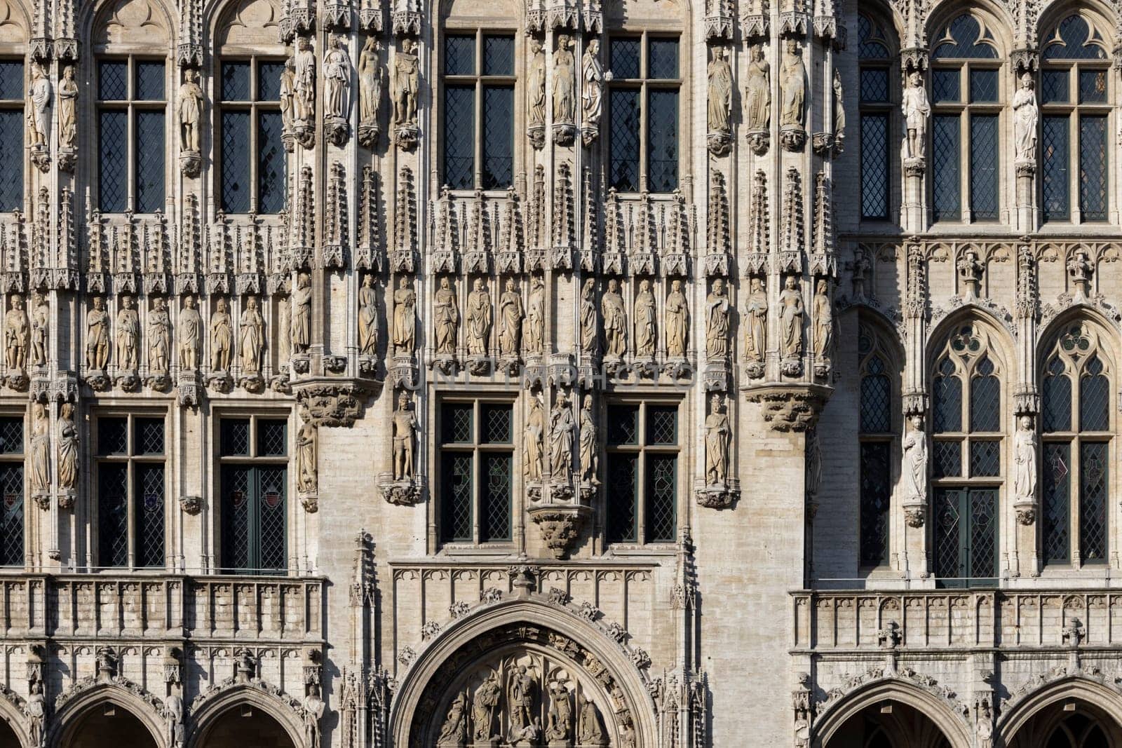 Brussels, Belgium - May 19, 2023: Medieval Brussels Town Hall in Grand Place, main market in the city. Statues of Dukes and Duchesses of Brabant on facade