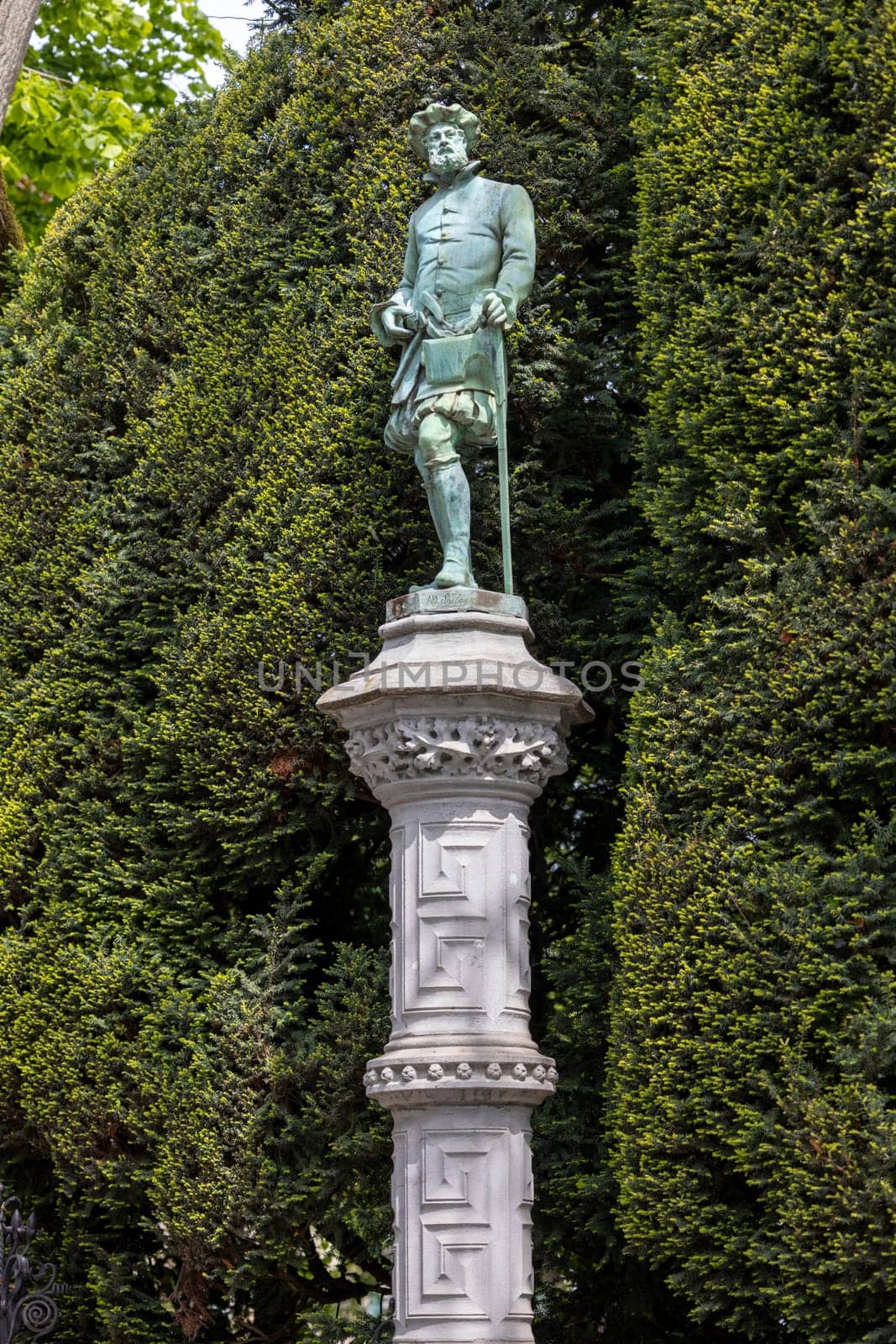 Brussels, Belgium - May 18, 2023: One of the 48 statues embodying various Brussels guilds in renaissance garden of Square of Petit Sablon