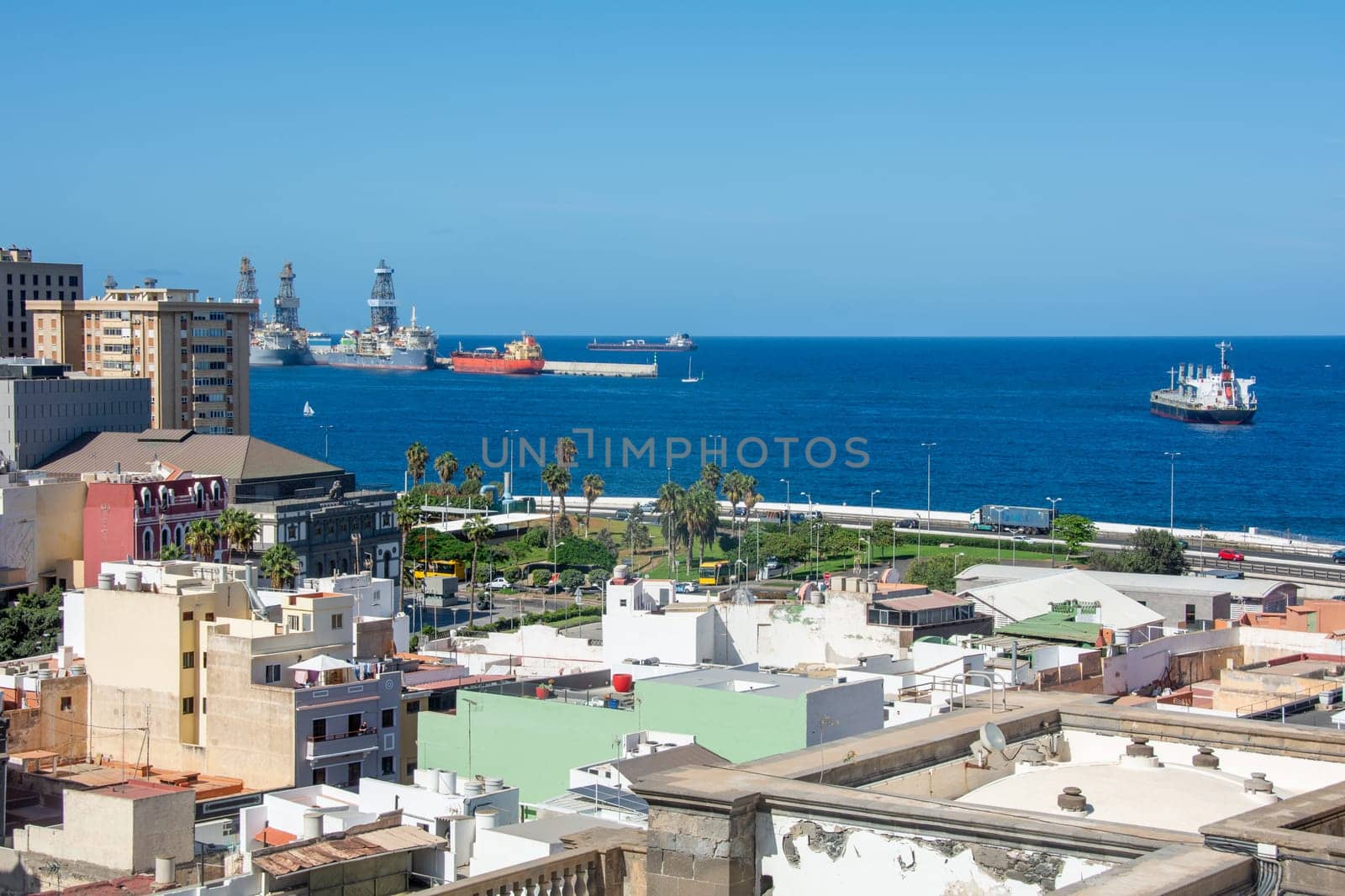 Panoramic view from above of the capital and part of the harbor in Las Palmas Gran Canaria in Spain with blue sky