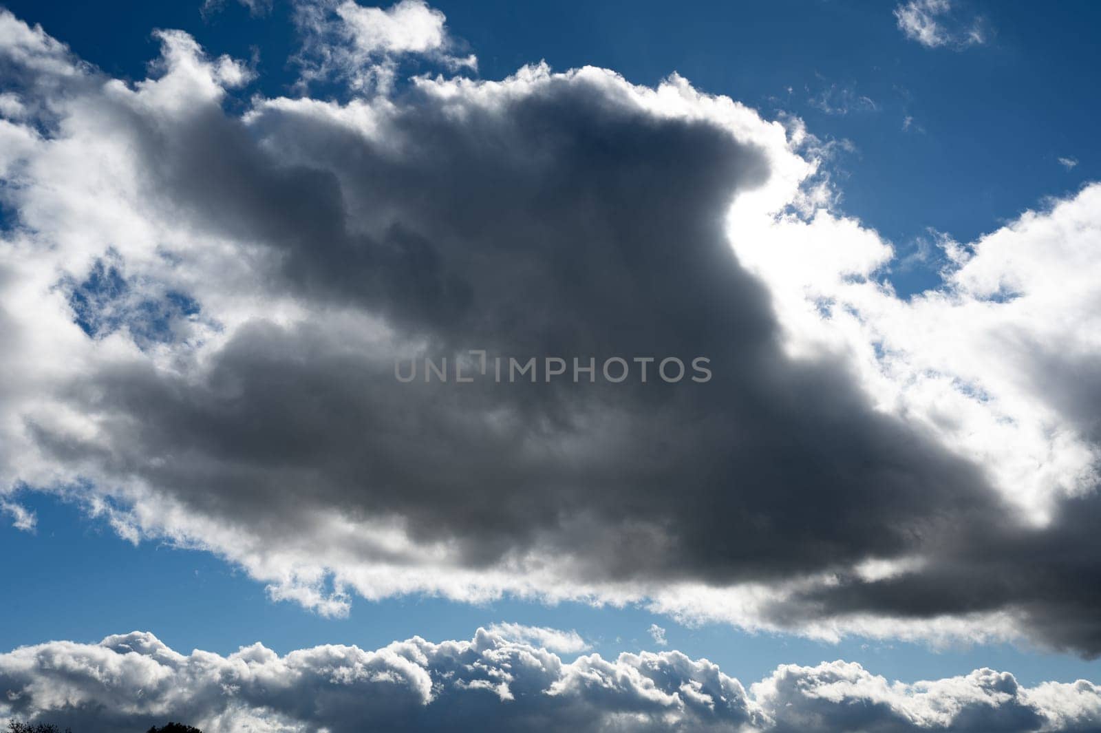 Dark clouds are gathering with blue sky