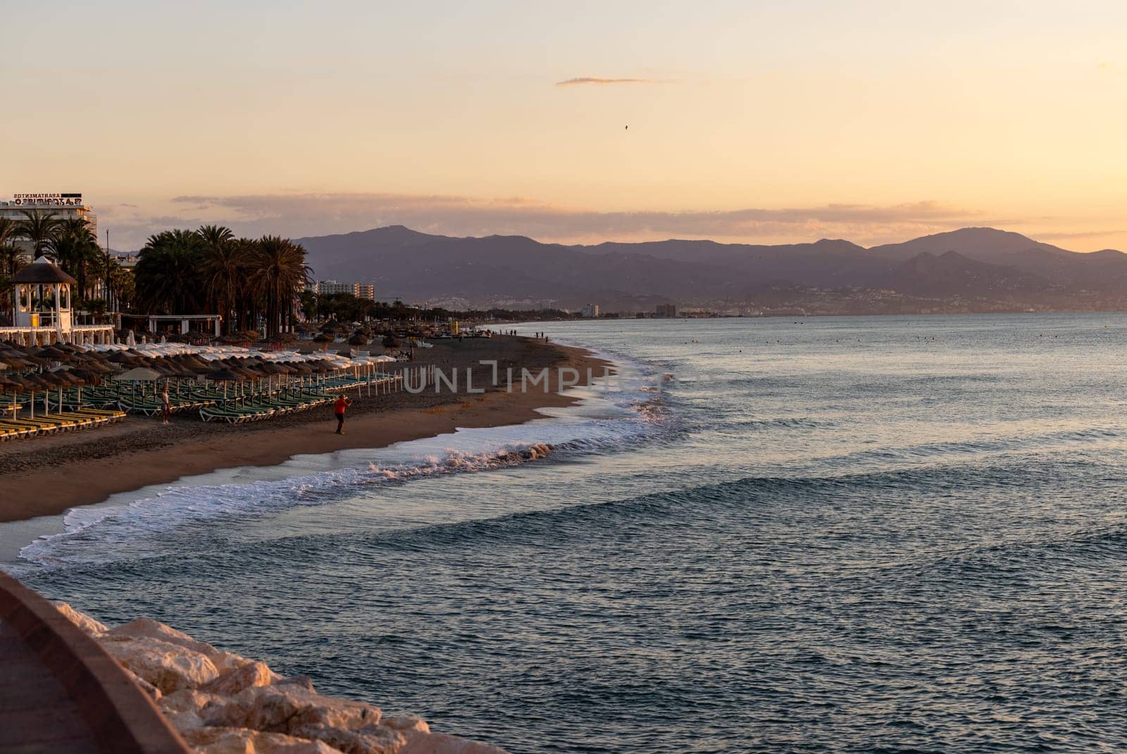 View of Bajondillo Beach in Torremolinos at sunrise. Costa del Sol, Spain.