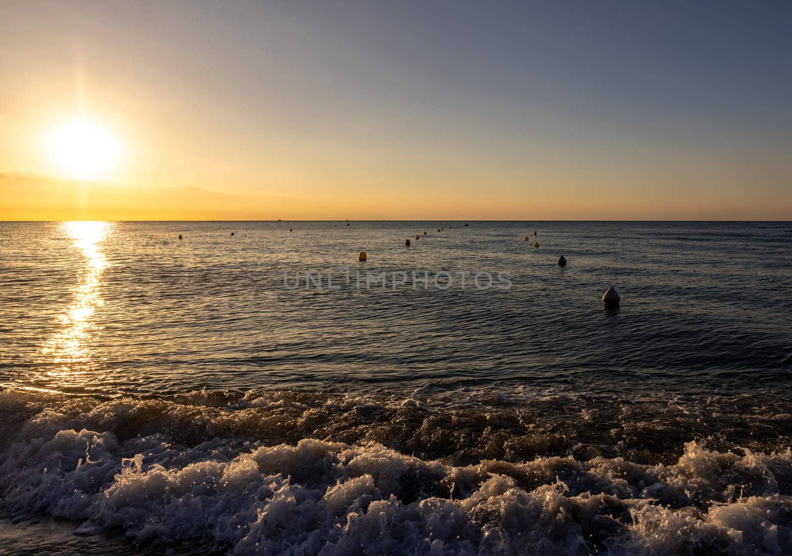 Sunrise over the Mediterranean Sea seen from the beach in Torremolinos. Costa del Sol, Spain