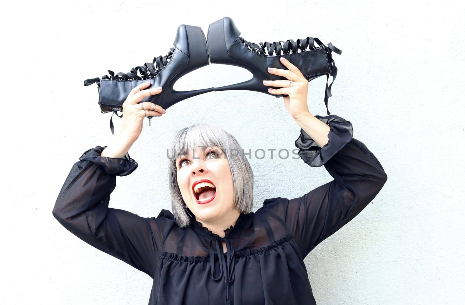 A woman is happy and delighted with her new shoes