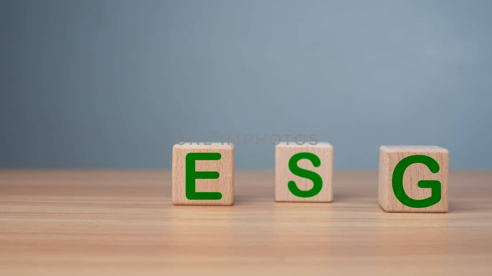ESG concept of environmental, social and governance, wood block and icon on wooden background It is an idea for sustainable organizational development ​account the green environment.