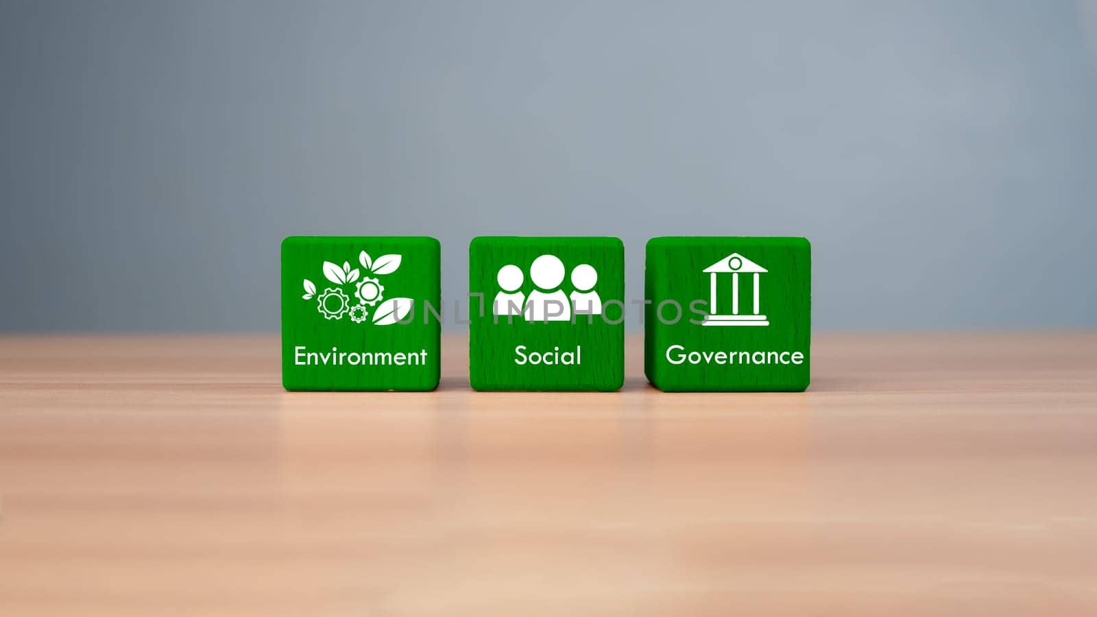 ESG concept of environmental, social and governance, wood block and icon on wooden background It is an idea for sustainable organizational development ​account the green environment.