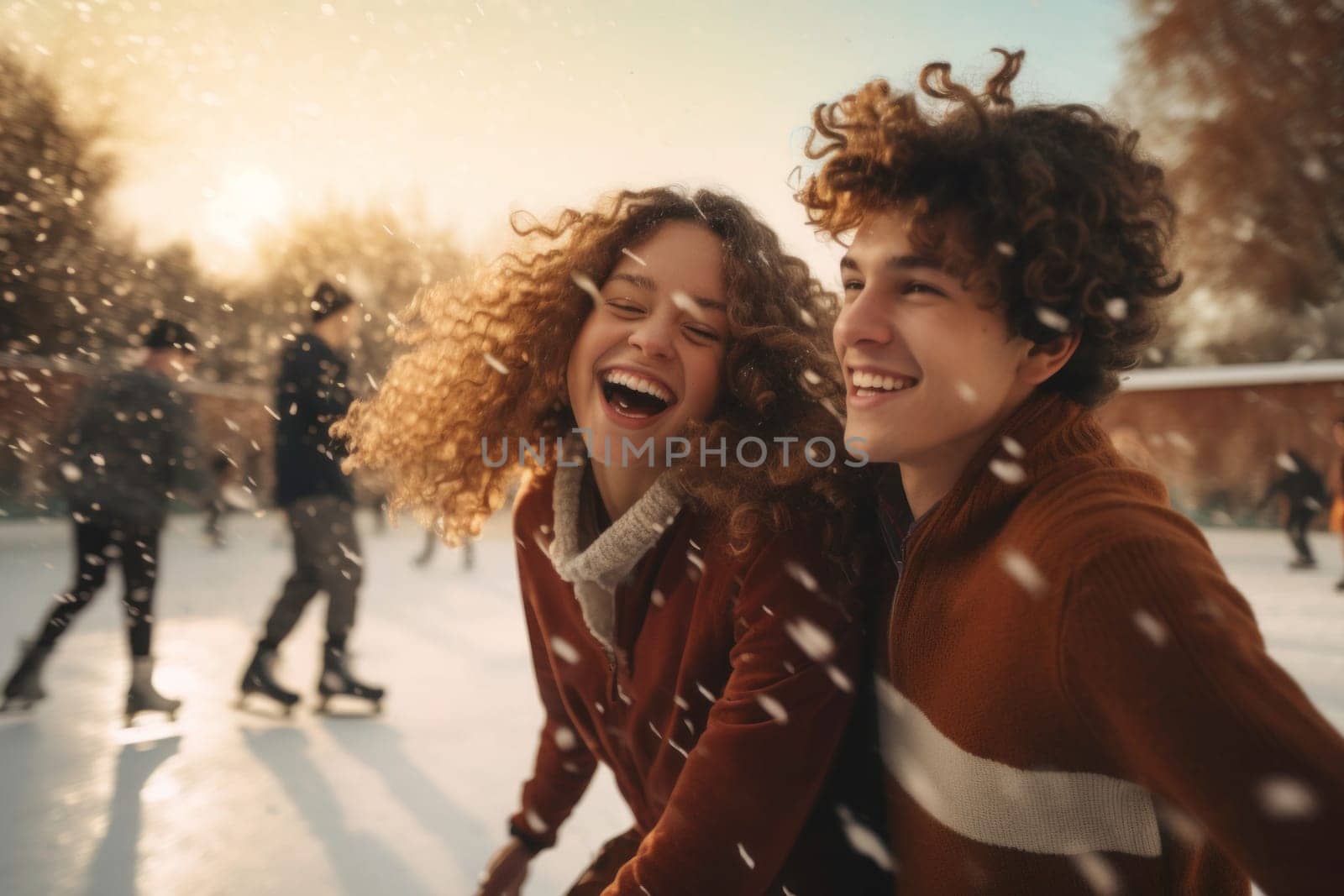 Happy couple of teenagers skating on ice on open rink. Having fun on winter holiday. Skaters enjoying winter holiday and ice skating. Sport and leisure on snow and ice. Snowy day. Wintertime. Winter activity