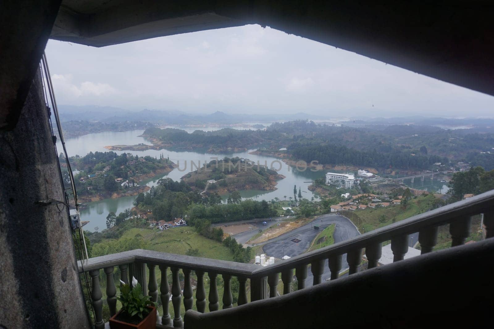 View from the staircase of the rock of Guatape, El Penon de Guatape on the surrounding lake landscape close to Medellin, Colombia 2020