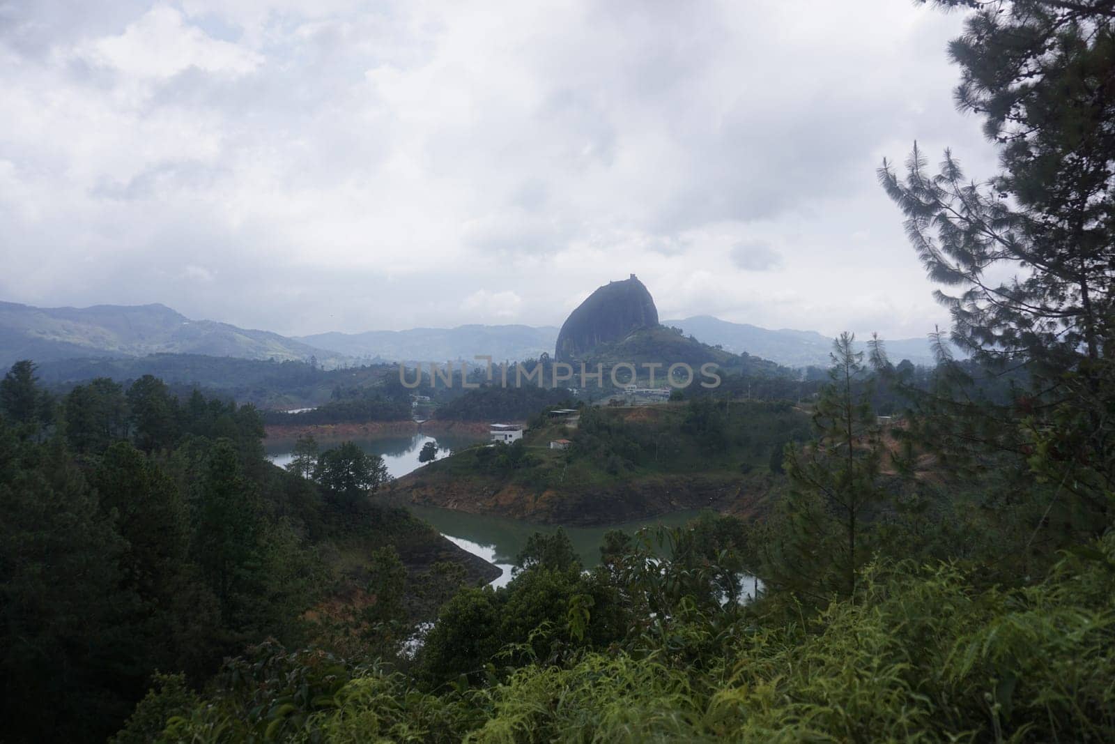 View on the Rock of Guatape, El Penon de Guatape close to Medellin from far, Colombia 2020