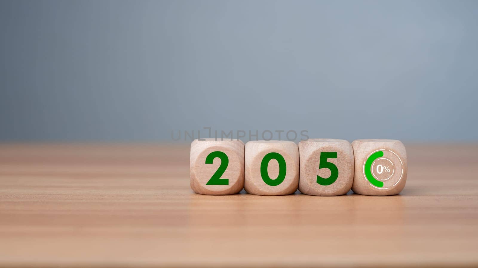 Wooden cubes with net zero icon in 2050 on wooden background, Net zero by 2050, Carbon neutral, Net zero green house gas emissions target, Climate neutral long term strategy, No toxic gases.
