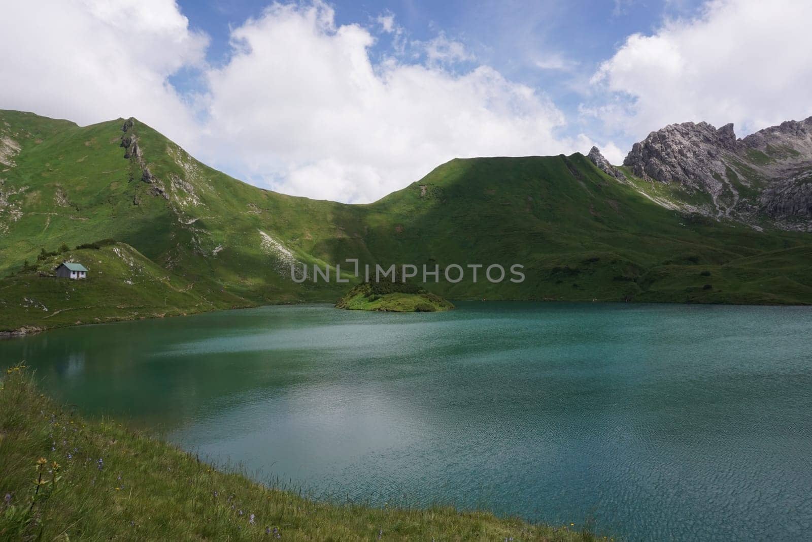 Beautiful turquoise color of lake Schrecksee in the german Alps, Allgäu, Germany 2020