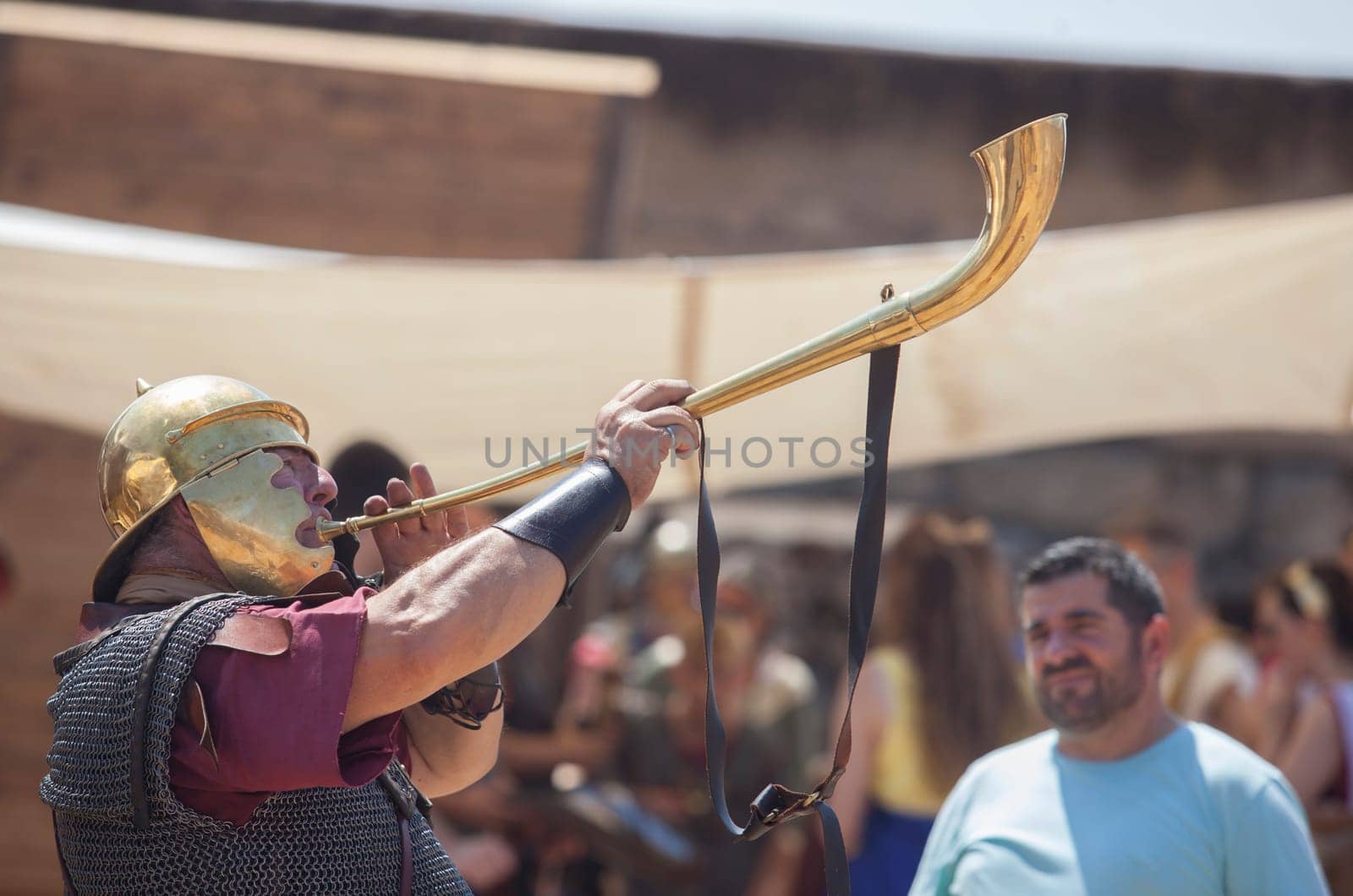 Merida, Spain - June 4th, 2023: Roman war-trumpeter performing. Emerita Ludica Festival 2023, Merida, Spain