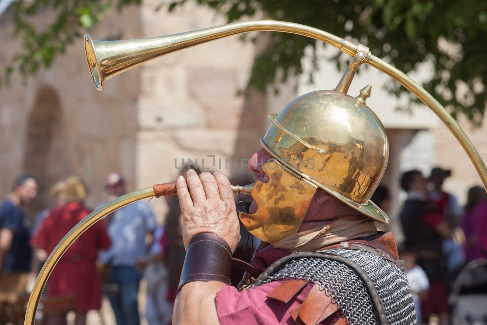 Merida, Spain - June 4th, 2023: Roman war-trumpeter performing. Emerita Ludica Festival 2023, Merida, Spain