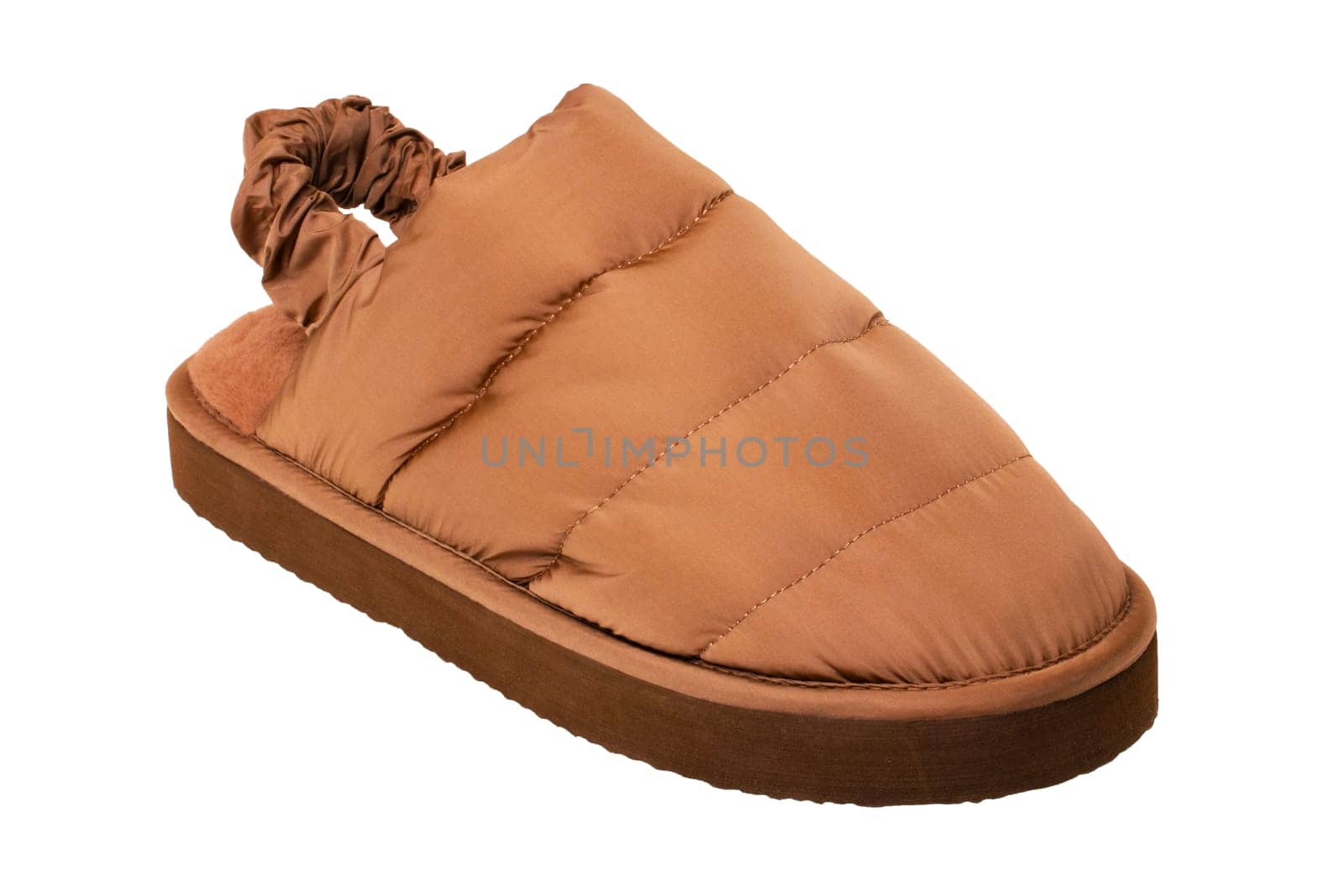 Slippers isolated. Close-up of a single of female brown warm and soft cosy terry house slipper isolated on white background. Womans shoes. Macro.