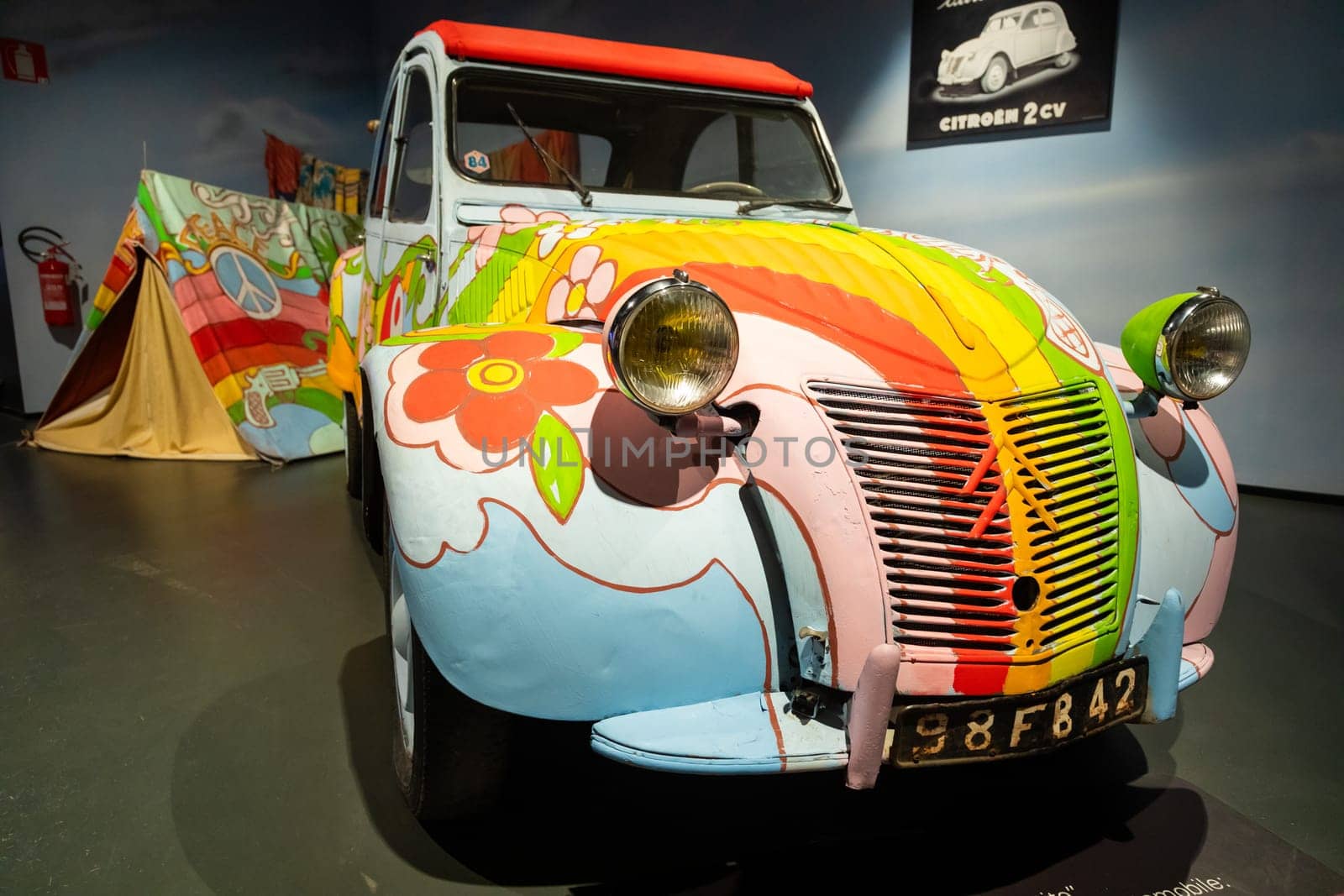 Turin, Italy - 11 november 2023: Car Museum. Citroen 2 CV, 1958. Vintage icon of hippies travel, adventure, peace.