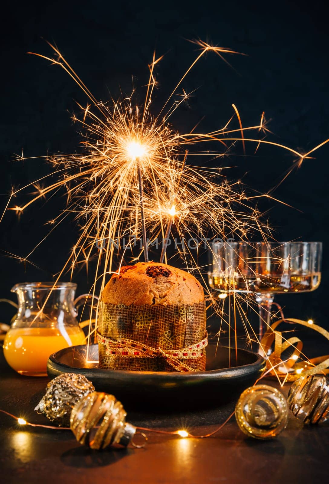 Traditional Christmas panettone with chocolate, traditional Italian cake for Christmas with sparkler