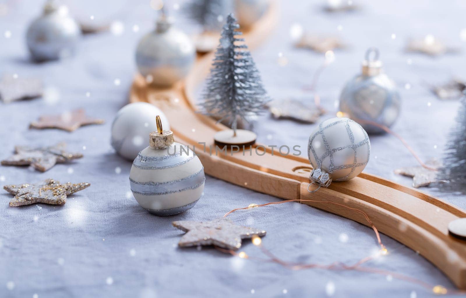 Festive table decoration with wooden railway for winter and Christmas, dining table  with ornaments