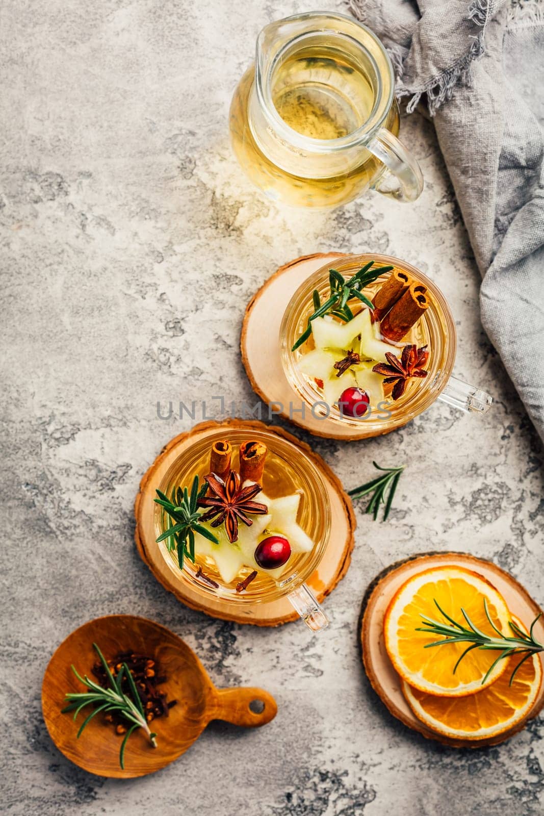 Delicious white mulled wine with apples, cranberries and spices