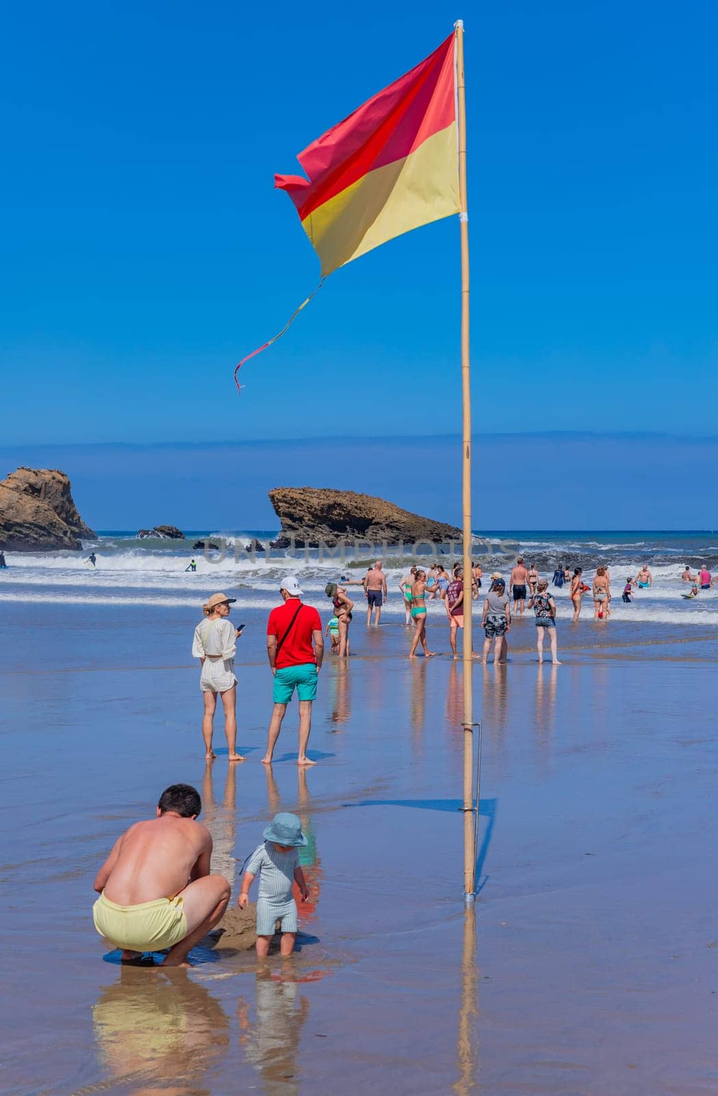 Biarritz, France, July 03, 2023: People at the beach Grande Plage (Big beach) in the French resort town of Biarritz.