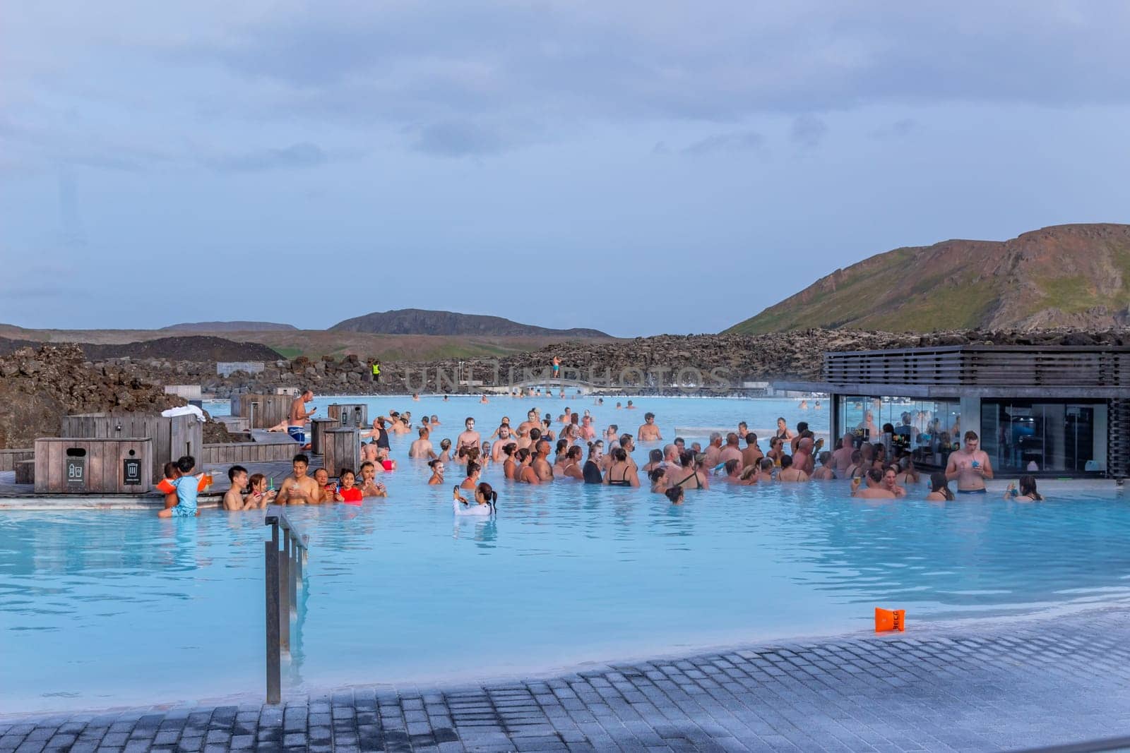 Reykjavik, Iceland - July 26, 2023:The Blue Lagoon geothermal spa is one of the most visited attractions in Iceland. People relax in the blue lagoon.