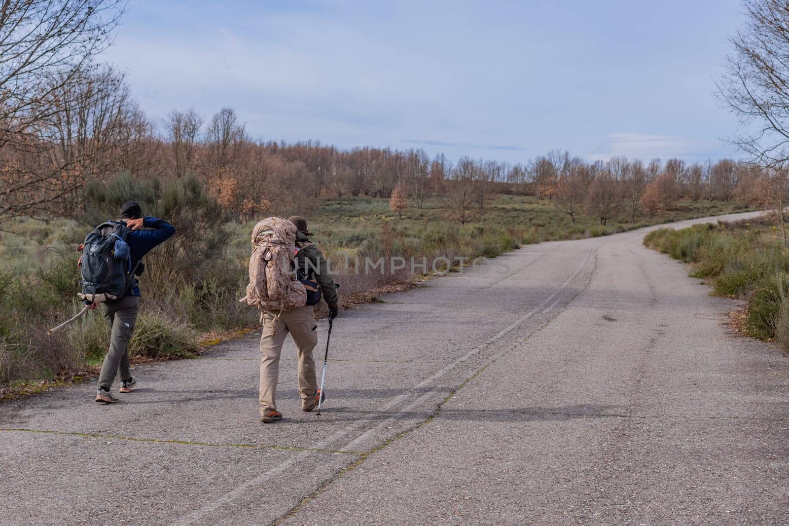 Galicia, Spain, 26 August, 2022: Pilgrims walk along the Camino De Santiago, the Way of St. James pilgrimage route, Galicia, Spain.