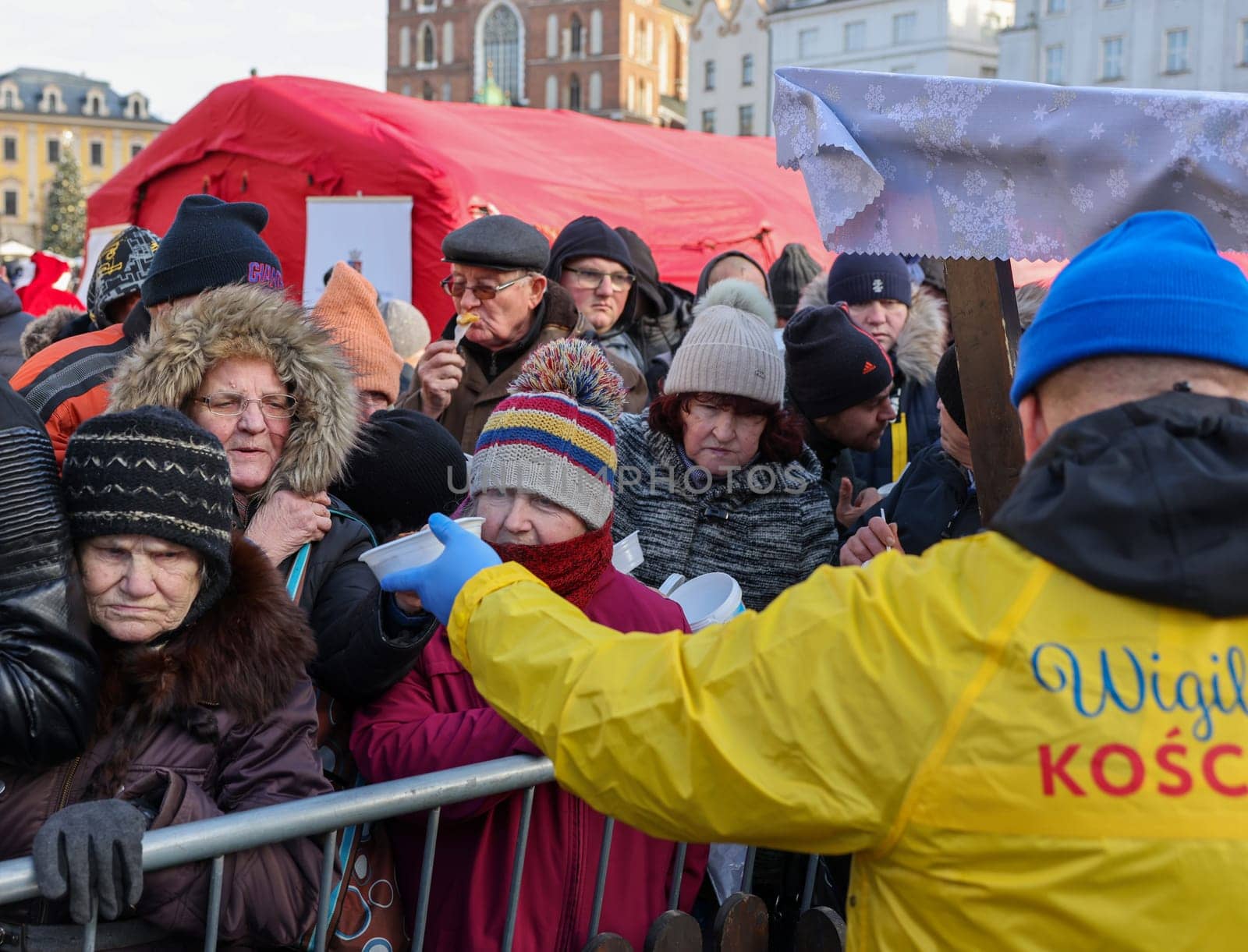Krakow, Poland - Dec 17, 2023: Christmas Eve for poor and homeless on the Main Square in Cracow. The group Kosciuszko prepares the greatest eve in the open air in Krakow