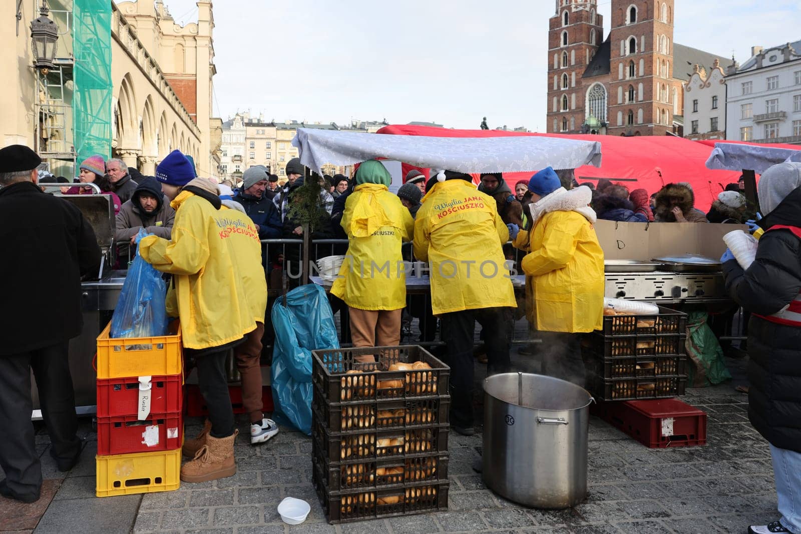 Krakow, Poland - Dec 17, 2023: Christmas Eve for poor and homeless on the Main Square in Cracow. The group Kosciuszko prepares the greatest eve in the open air in Krakow