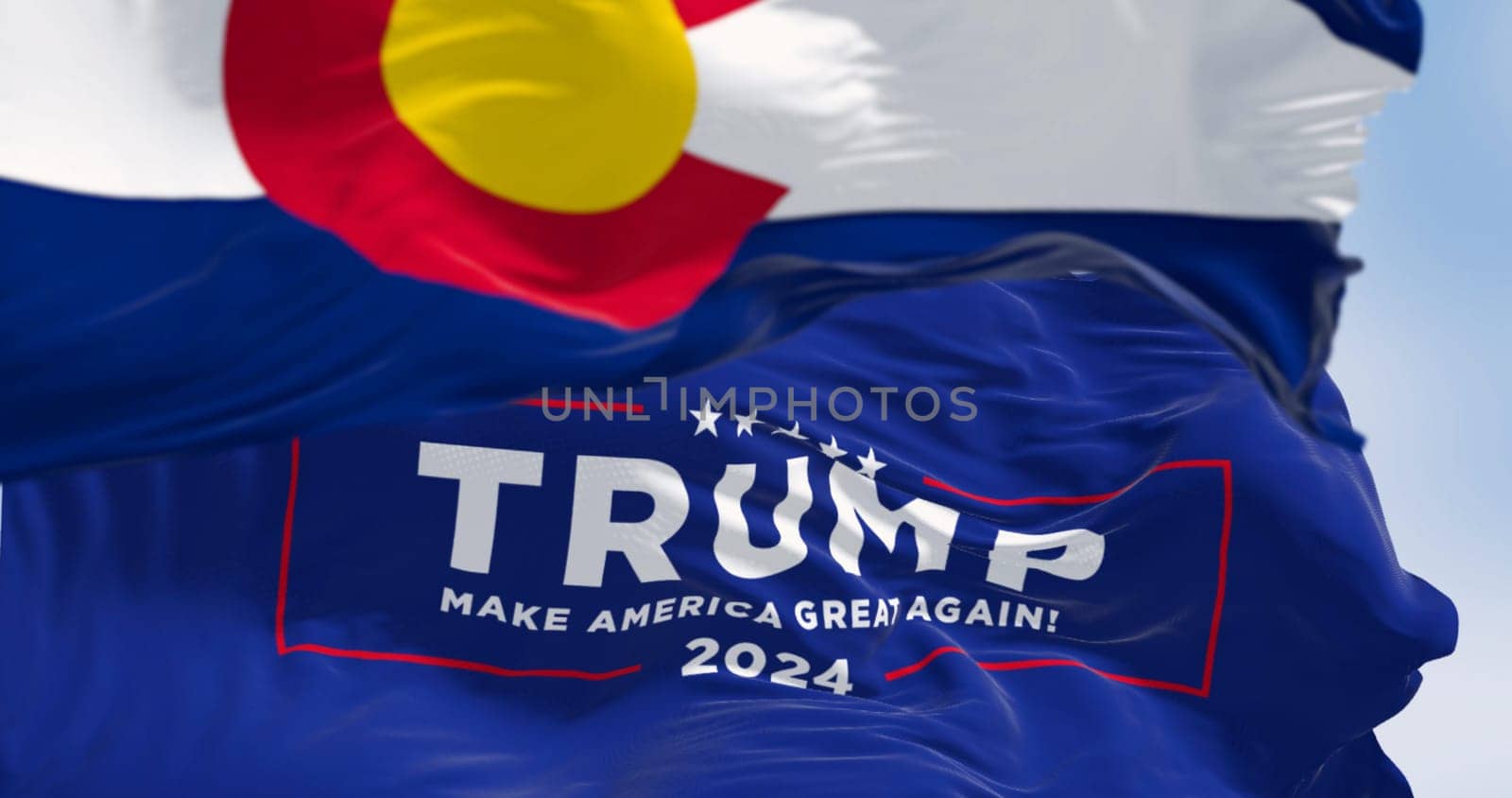 Denver, US, Dec.20 2023: Trump 2024 campaign flag waving with Colorado State flag. On Dec. 2023 Colorado Supreme Court Rules Trump Ineligible for Presidency. Illustrative editorial illustration