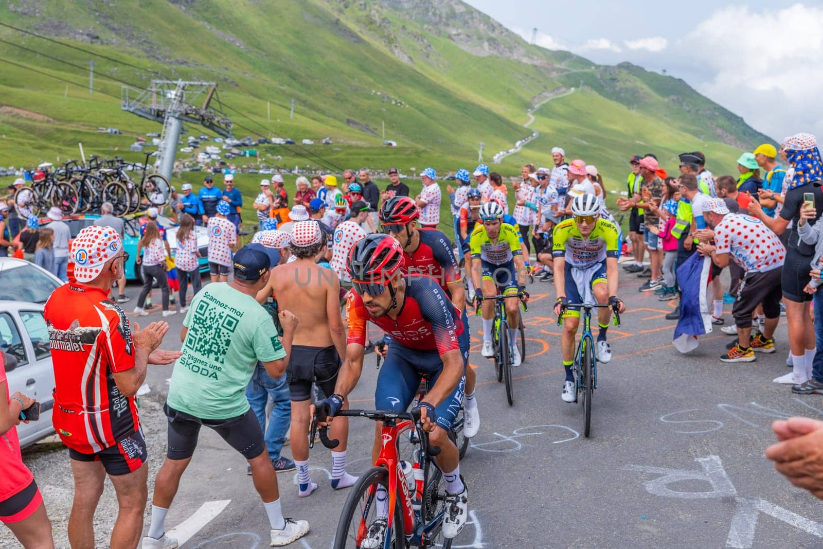 Col du Tourmalet, France - July 06 2023: Riders climbig the road to Col du Tourmalet in Pyerenees mountains during the stage 6 of Le Tour de France 2023.