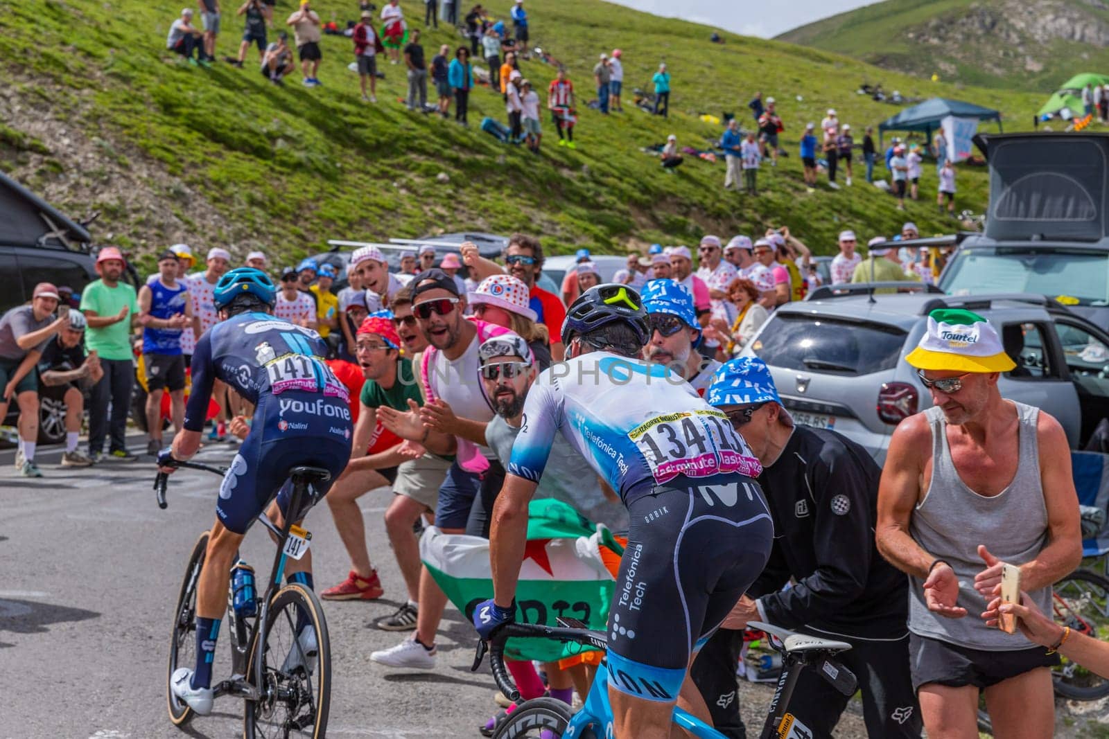 Col du Tourmalet, France - July 06 2023: Gorka Izagirre and Romain Bardet climbig the road to Col du Tourmalet in Pyerenees mountains during the stage 6 of Le Tour de France 2023.