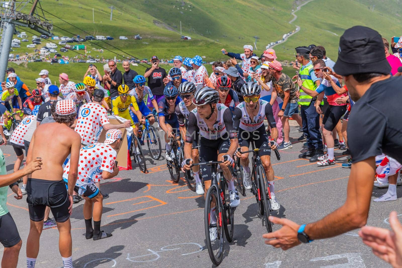 Col du Tourmalet, France - July 06 2023: Emirates Team climbig the road to Col du Tourmalet in Pyerenees mountains during the stage 6 of Le Tour de France 2023.