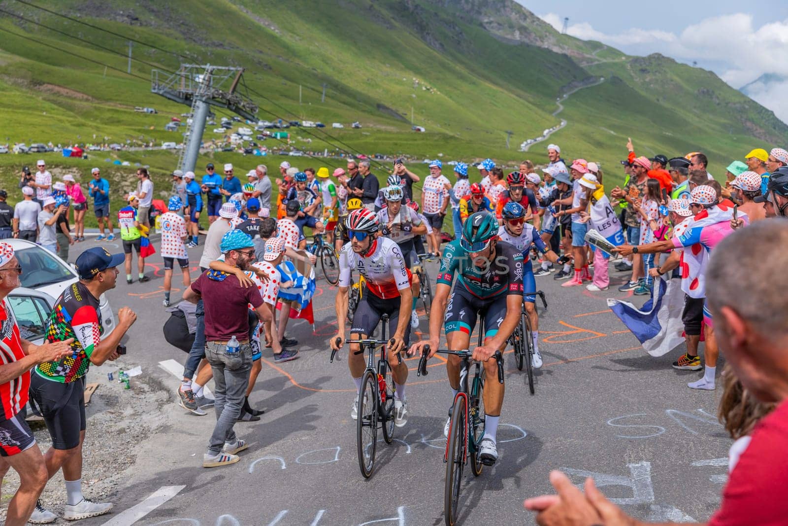 Col du Tourmalet, France - July 06 2023: Riders climbig the road to Col du Tourmalet in Pyerenees mountains during the stage 6 of Le Tour de France 2023.