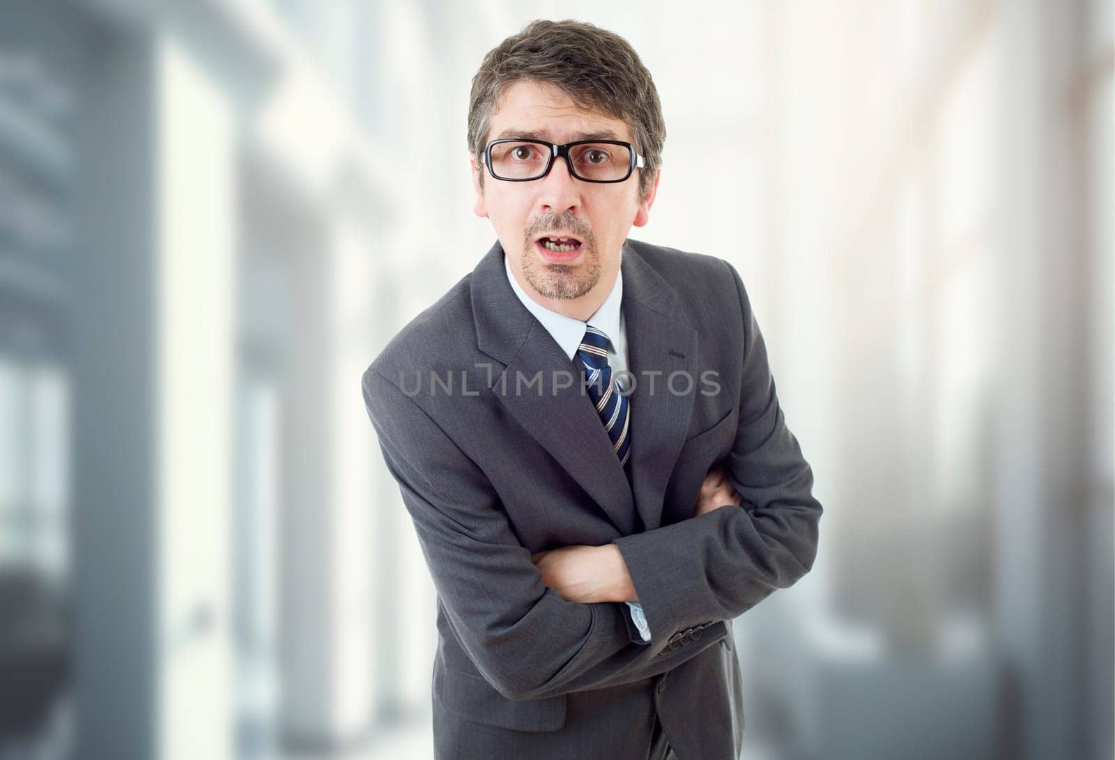 young business man surprised, at the office
