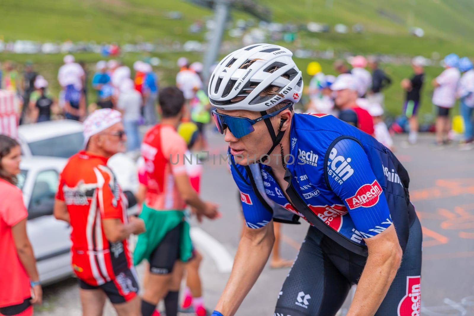 Col du Tourmalet, France - July 06 2023: Soren Kragh Andersen climbig the road to Col du Tourmalet in Pyerenees mountains during the stage 6 of Le Tour de France 2023.